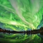 Aurora Fantasy by Yuichi Takasaka Green swirls of light from the aurora borealis.