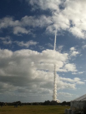 The Atlas V rocket carrying the Mars Science Labratory races through the clouds.