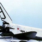 The Buran space shuttle mounted on a plane for transport.