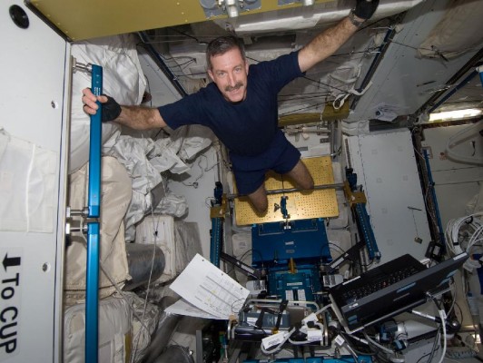 Expedition 30 commander floats weightlessly aboard the ISS