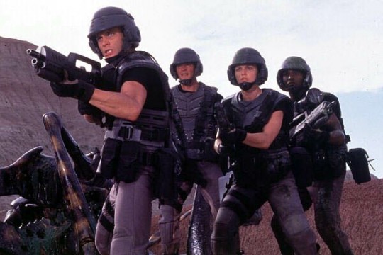 Starship Troopers Fighting A Battle A still from the movie Starship Troopers in which they look ready to fight!